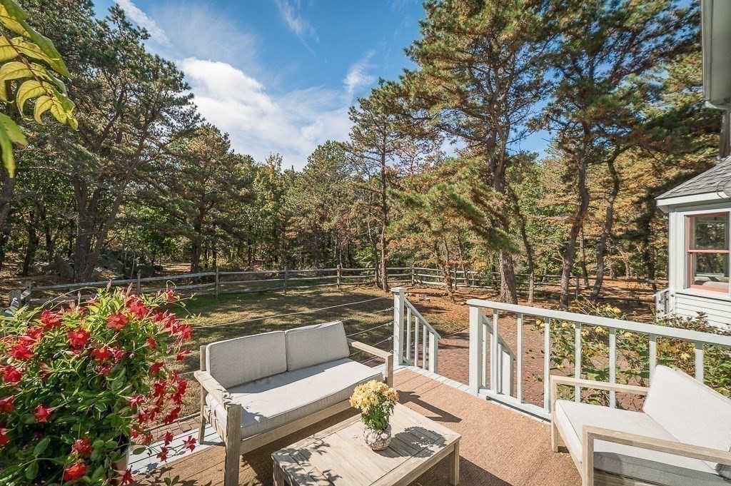25 Leverett Street Gloucester, MA 01930 - Photo 26 of 41 a balcony with furniture and flowers