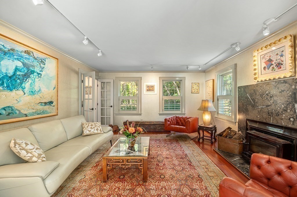 25 Leverett Street Gloucester, MA 01930 - Photo 9 of 41 a living room with furniture flat screen tv and a large window