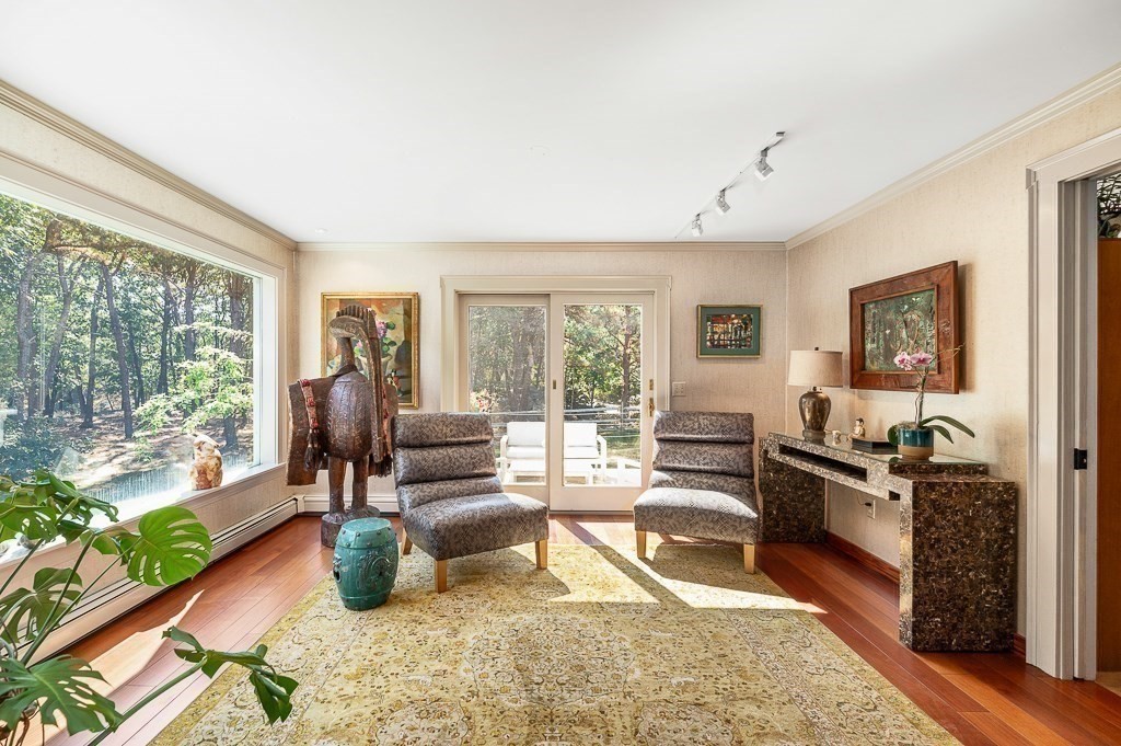 25 Leverett Street Gloucester, MA 01930 - Photo 10 of 41 a living room with furniture large windows and wooden floor