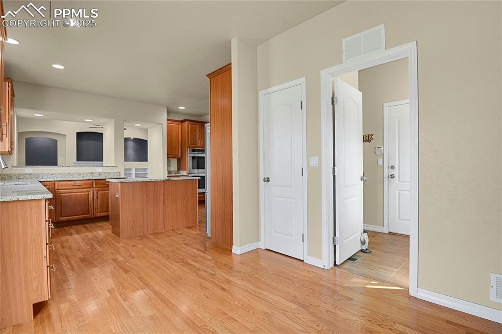 10530 Pictured Rocks Drive Peyton, CO 80831 - Photo 14 of 50 a view of a kitchen with wooden floor and a kitchen
