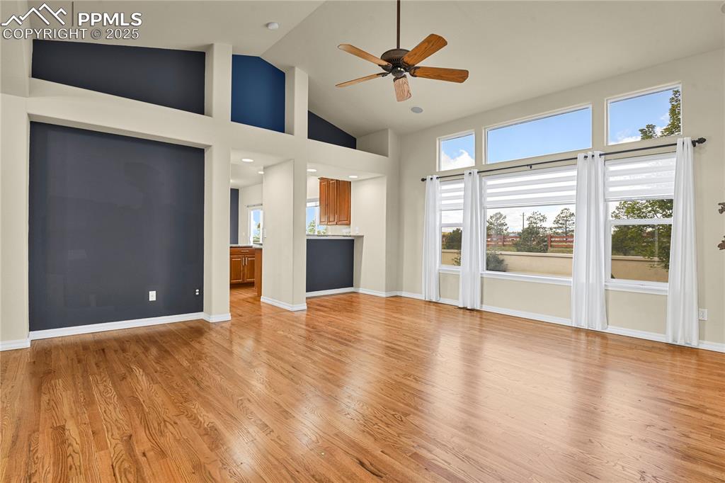 10530 Pictured Rocks Drive Peyton, CO 80831 - Photo 16 of 50 a view of an empty room with a window and wooden floor