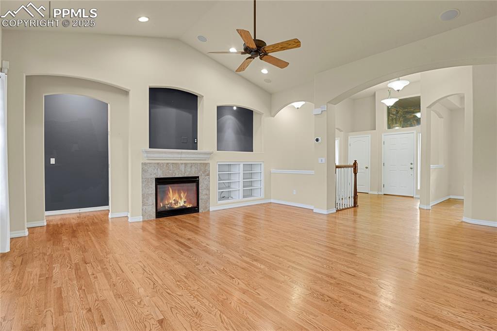 10530 Pictured Rocks Drive Peyton, CO 80831 - Photo 18 of 50 a view of a livingroom with a fireplace a ceiling fan and front door