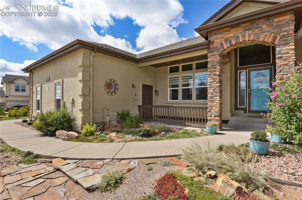 10530 Pictured Rocks Drive Peyton, CO 80831 - Photo 2 of 50 a front view of a house