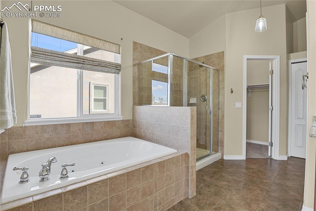 10530 Pictured Rocks Drive Peyton, CO 80831 - Photo 28 of 50 a bathroom with a bathtub and a shower