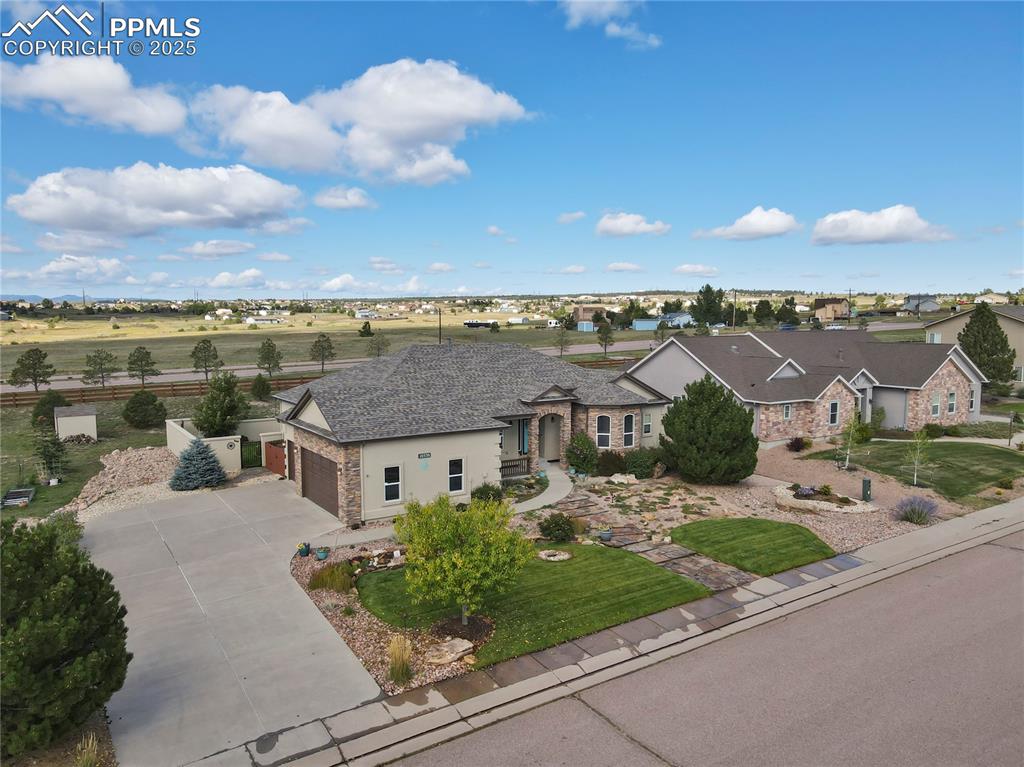 10530 Pictured Rocks Drive Peyton, CO 80831 - Photo 43 of 50 an aerial view of a house with a garden and lake view