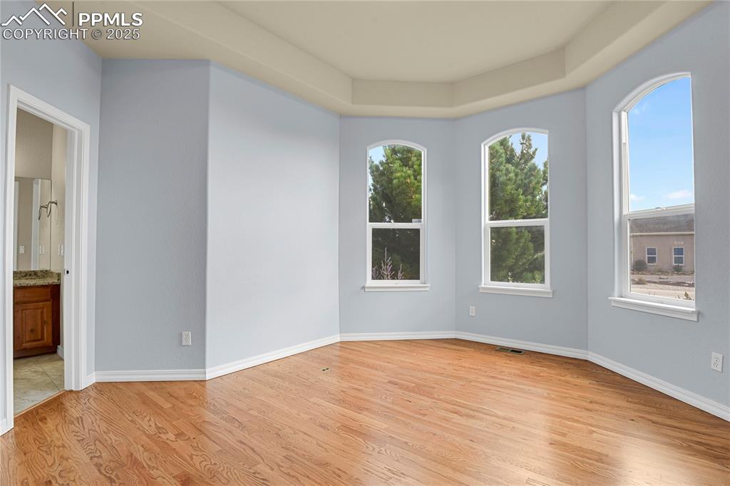 10530 Pictured Rocks Drive Peyton, CO 80831 - Photo 7 of 50 a view of an empty room with wooden floor and a window