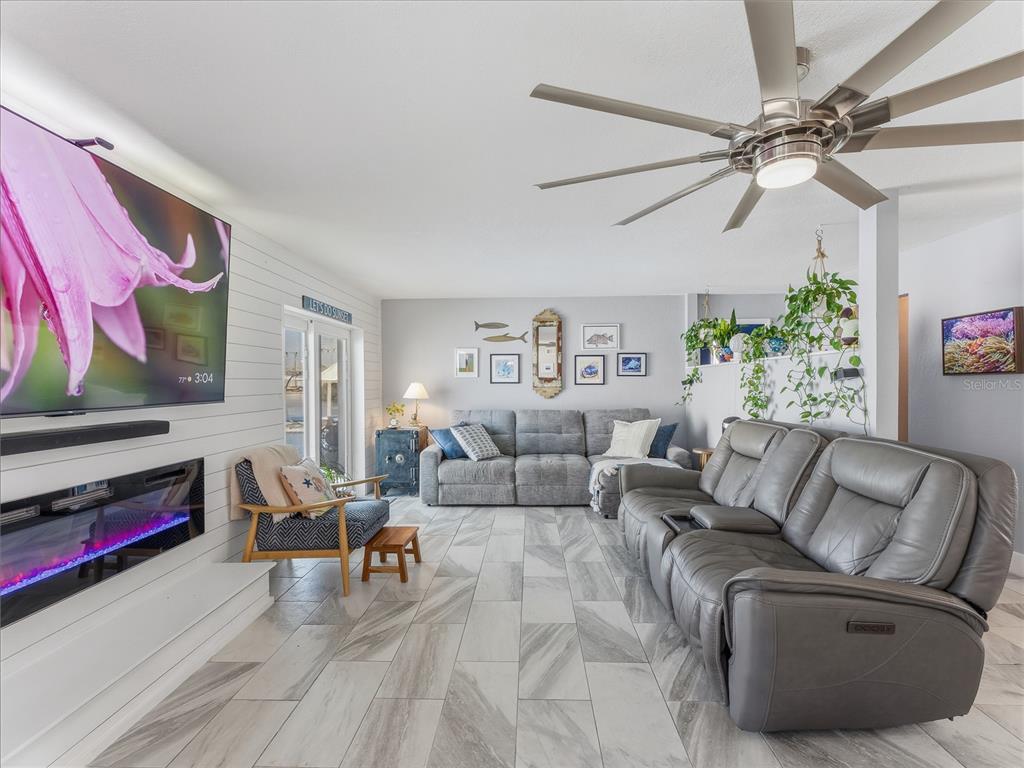 3173 Gulfview Drive Hernando Beach, FL 34607 - Photo 12 of 75 a living room with furniture and a flat screen tv
