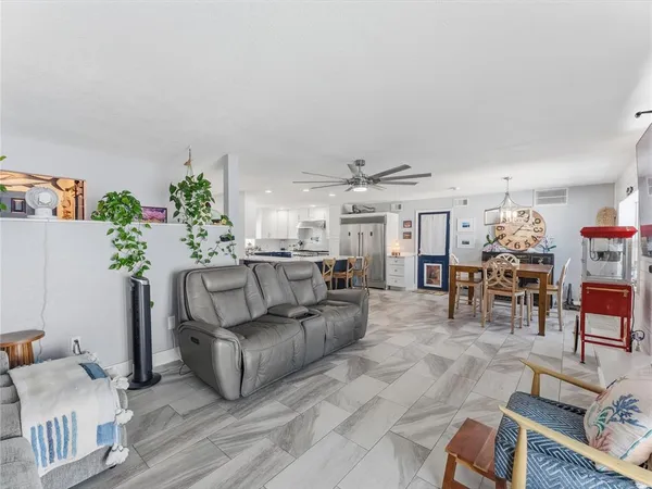 a kitchen with stainless steel appliances granite countertop wooden cabinets sink and stove