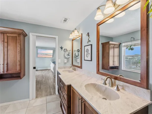 a bathroom with a shower and a sink