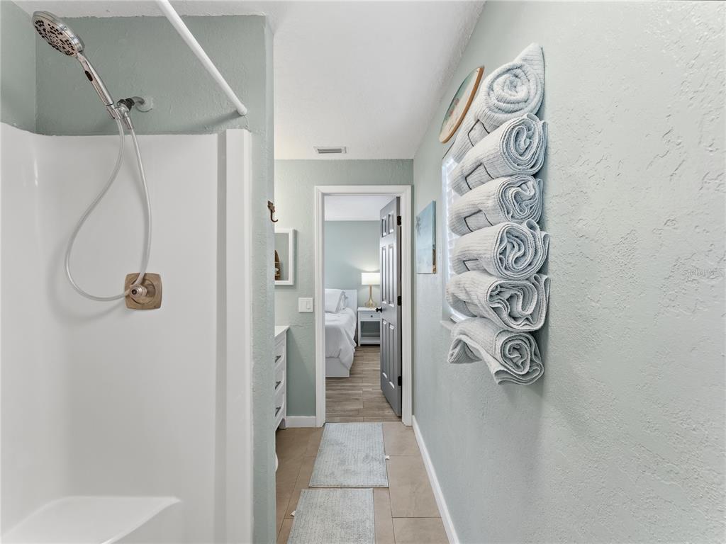 3173 Gulfview Drive Hernando Beach, FL 34607 - Photo 34 of 75 a bathroom with a shower and a sink