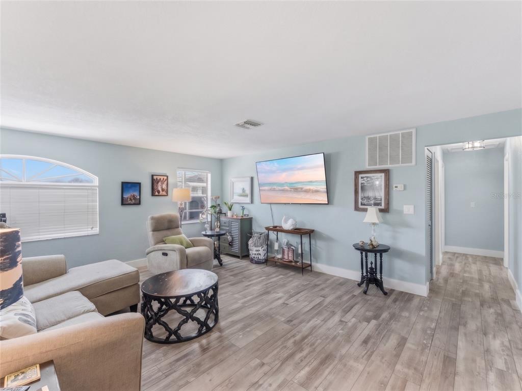 3173 Gulfview Drive Hernando Beach, FL 34607 - Photo 39 of 75 a living room with furniture and a wooden floor