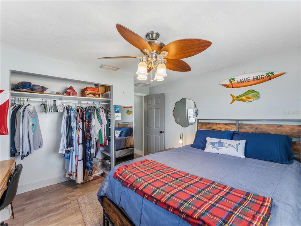 3173 Gulfview Drive Hernando Beach, FL 34607 - Photo 42 of 75 a bedroom with a bed and a chandelier