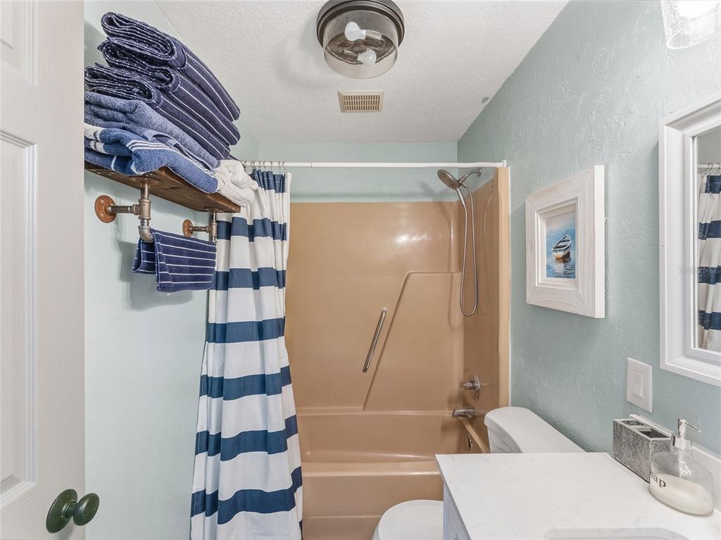 3173 Gulfview Drive Hernando Beach, FL 34607 - Photo 44 of 75 a bathroom with a bathtub and shower