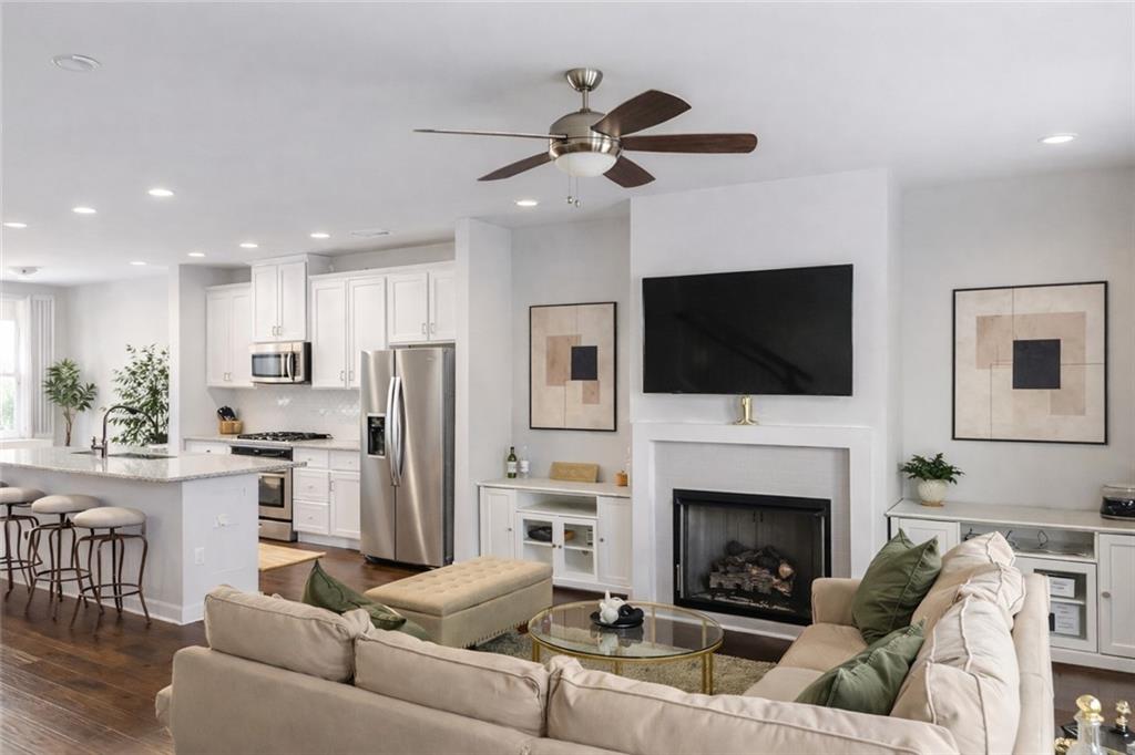 2170 Wiggins Walk Atlanta, GA 30316 - Photo 4 of 17 a living room with furniture fireplace and flat screen tv