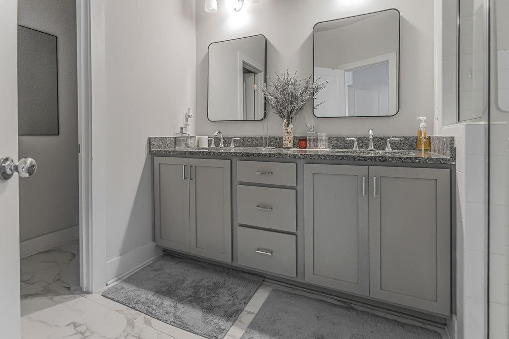 2170 Wiggins Walk Atlanta, GA 30316 - Photo 6 of 17 a bathroom with double sink and a mirror