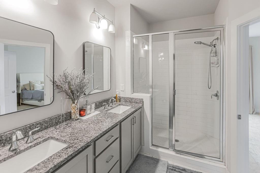 2170 Wiggins Walk Atlanta, GA 30316 - Photo 7 of 17 a bathroom with double sink and a mirror