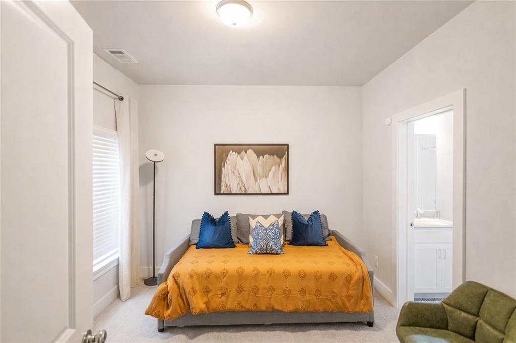 2170 Wiggins Walk Atlanta, GA 30316 - Photo 8 of 17 a bedroom with a bed and couch