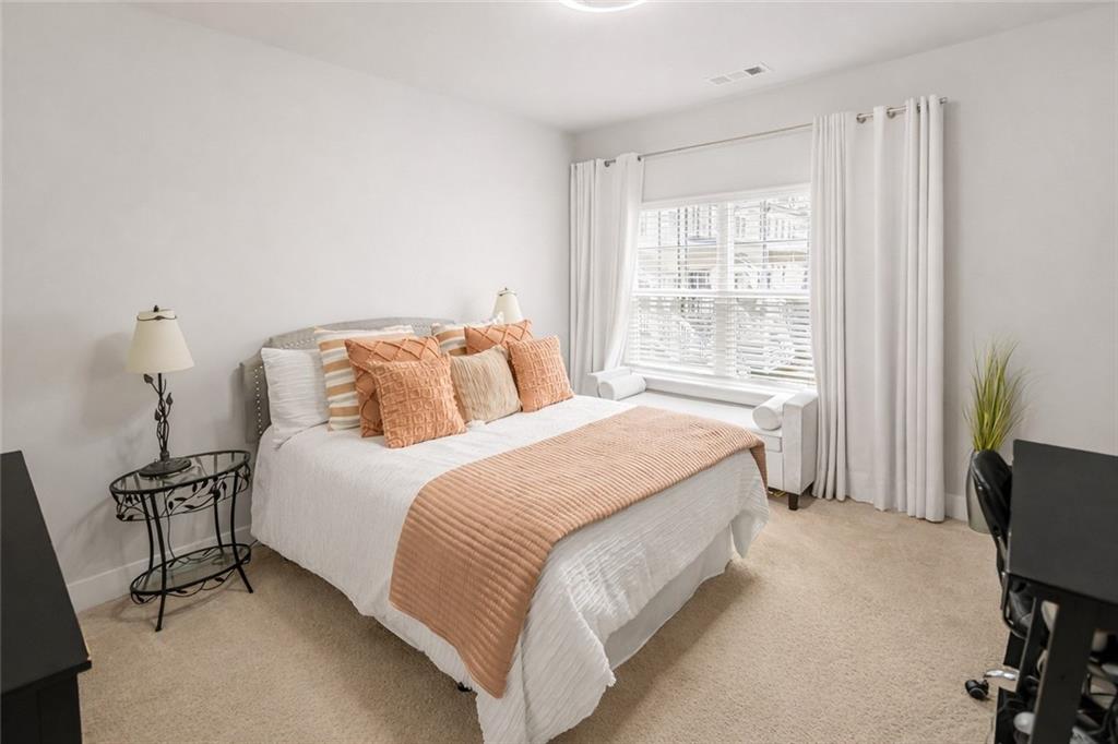 2170 Wiggins Walk Atlanta, GA 30316 - Photo 9 of 17 a bedroom with a bed and a window