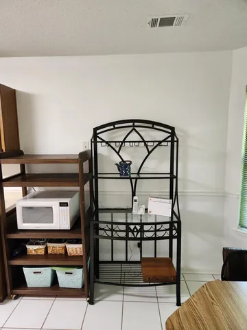 a kitchen with a stove microwave and sink
