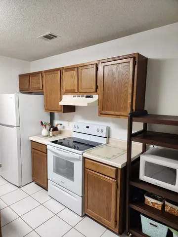 a view of a hallway with workspace