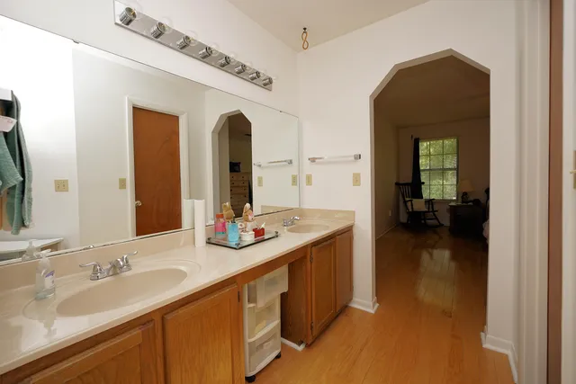 a en suite bathroom with a sink and a mirror
