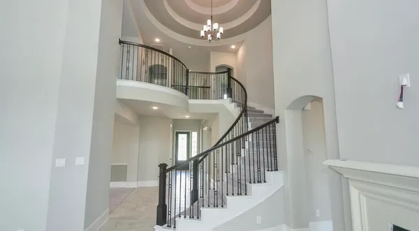 a view of entryway and hall with a front door