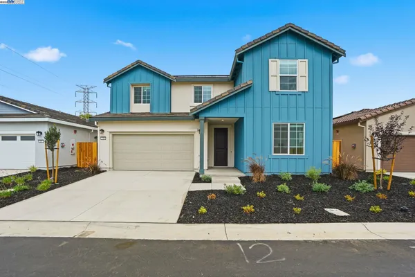 a front view of a house with garage