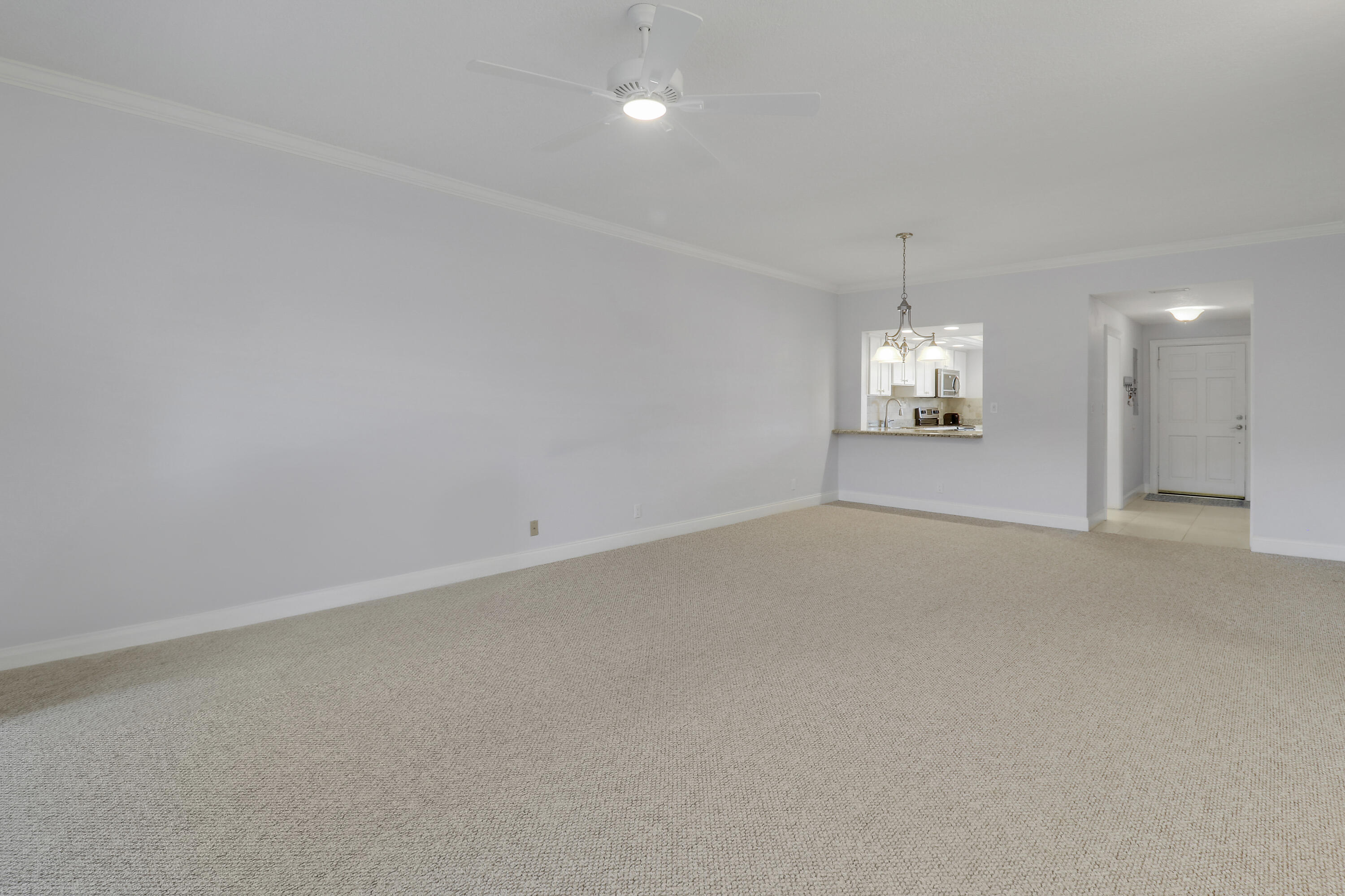 275 South Beach Road, Unit B202 Tequesta, FL 33469 - Photo 12 of 37 a view of empty room with wooden floor