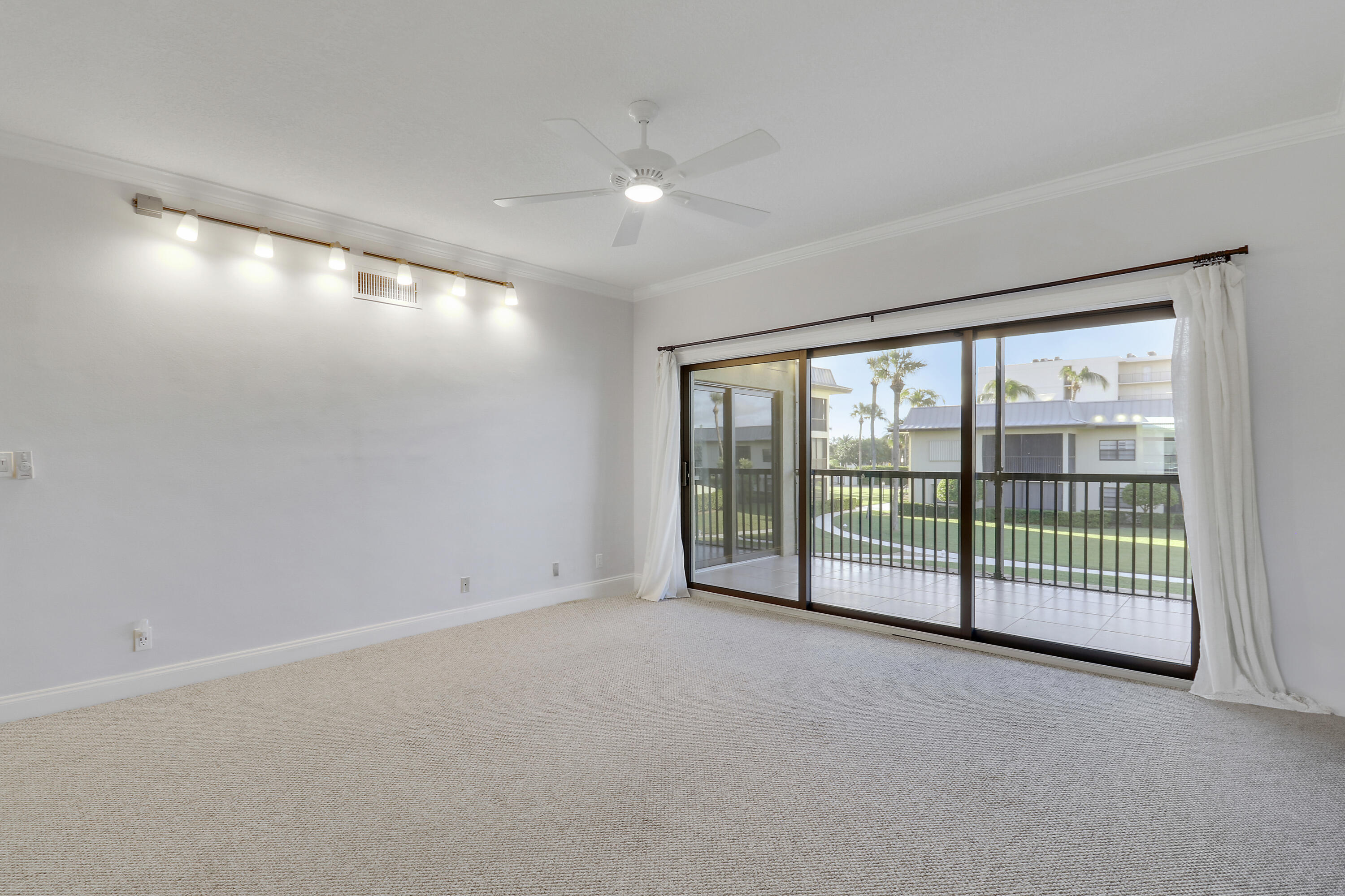 275 South Beach Road, Unit B202 Tequesta, FL 33469 - Photo 14 of 37 a view of an empty room with windows