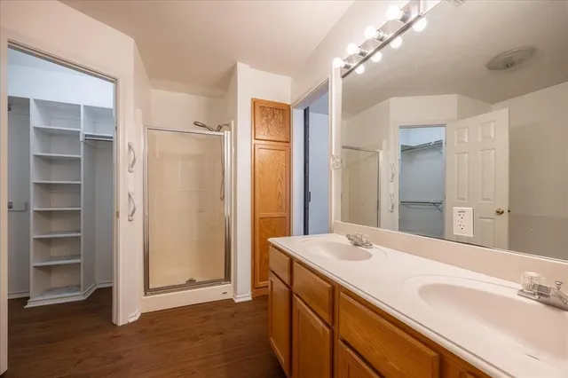 a bathroom with a sink mirror vanity and toilet