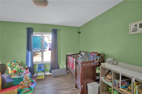 a living room with baby crib furniture and a baby crib