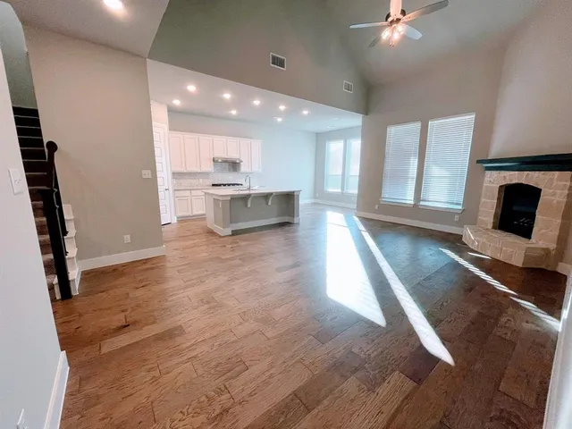 a view of a living room a fireplace with wooden floor