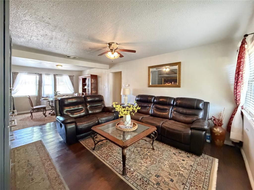 2243 Inca Drive Dallas, TX 75216 - Photo 23 of 24 The open-concept floor plan flows seamlessly into the dining area.