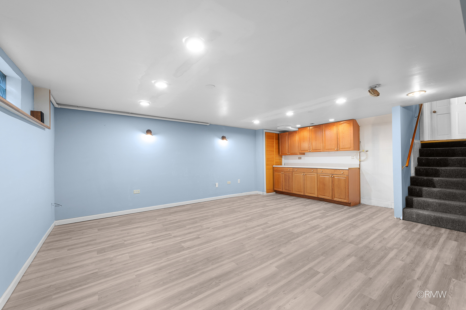 18 South Vista Avenue Addison, IL 60101 - Photo 14 of 32 a view of a room with wooden floor and staircase