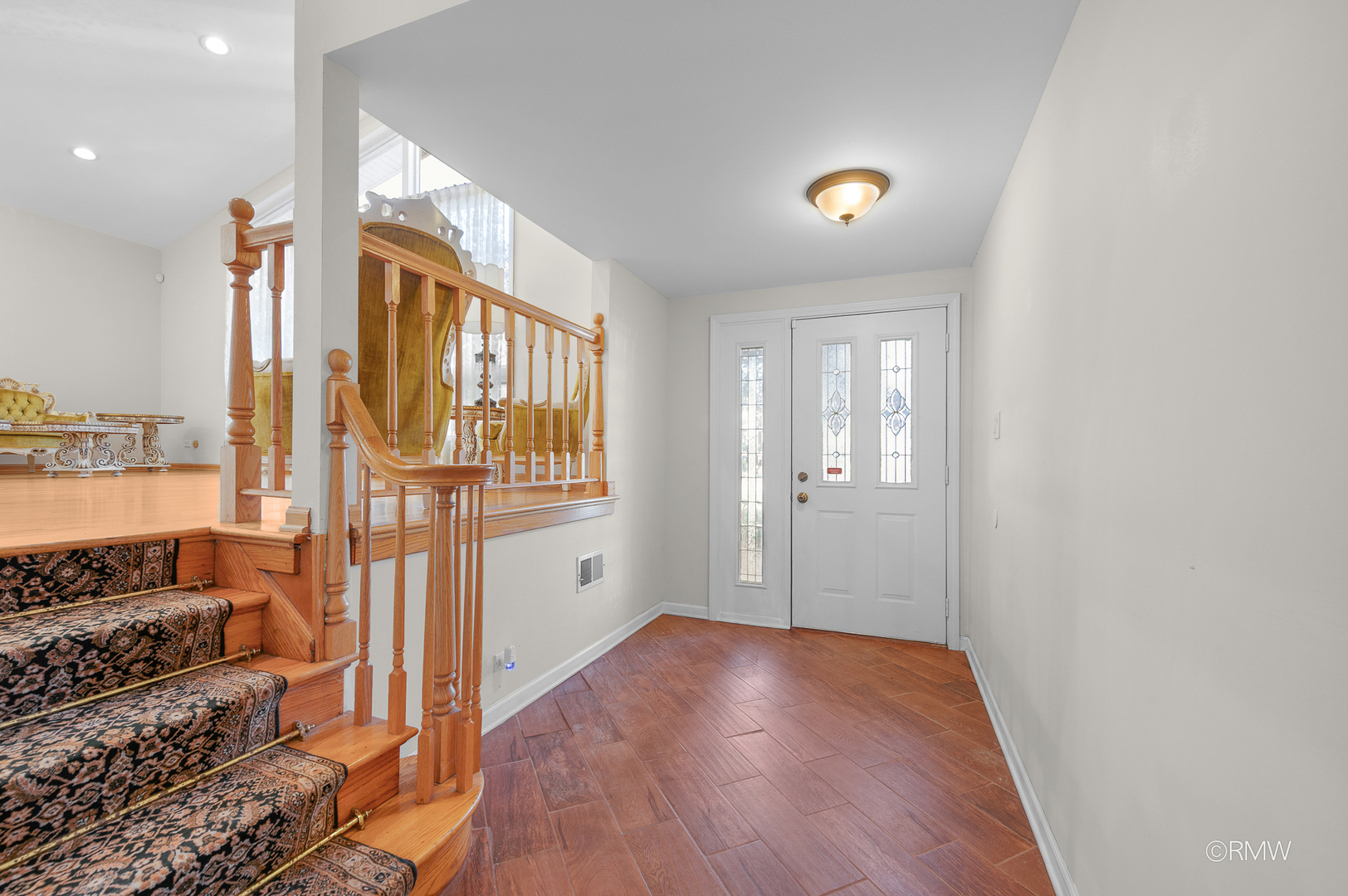 18 South Vista Avenue Addison, IL 60101 - Photo 3 of 32 a view of a hallway with a livingroom with wooden floor