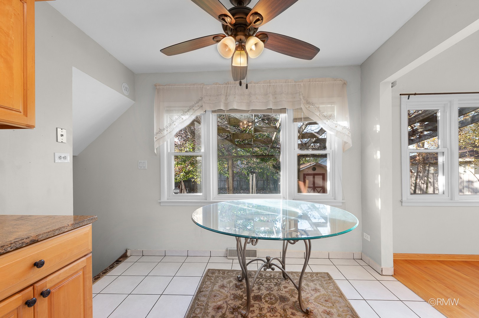 18 South Vista Avenue Addison, IL 60101 - Photo 9 of 32 a view of a dining room with furniture window and wooden floor