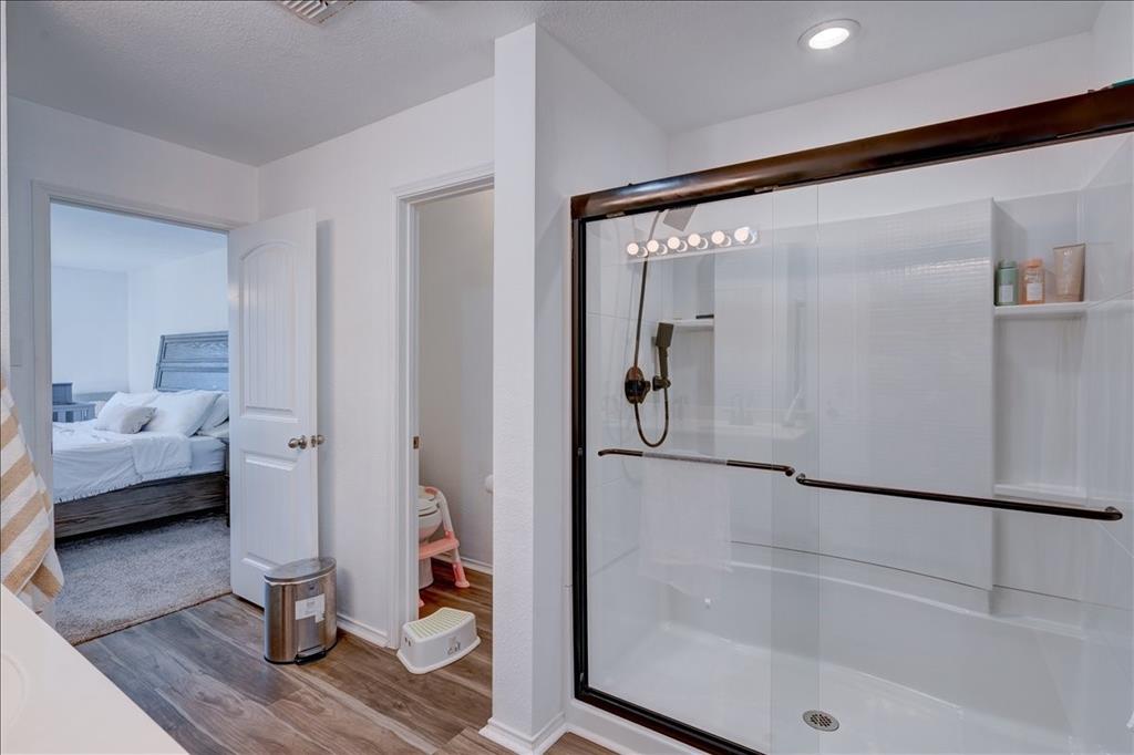 6233 Skysail Road Fort Worth, TX 76179 - Photo 19 of 30 a bathroom with a tub and shower