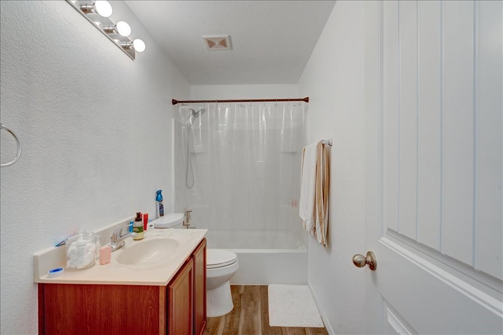 6233 Skysail Road Fort Worth, TX 76179 - Photo 22 of 30 a bathroom with a sink vanity tub and shower