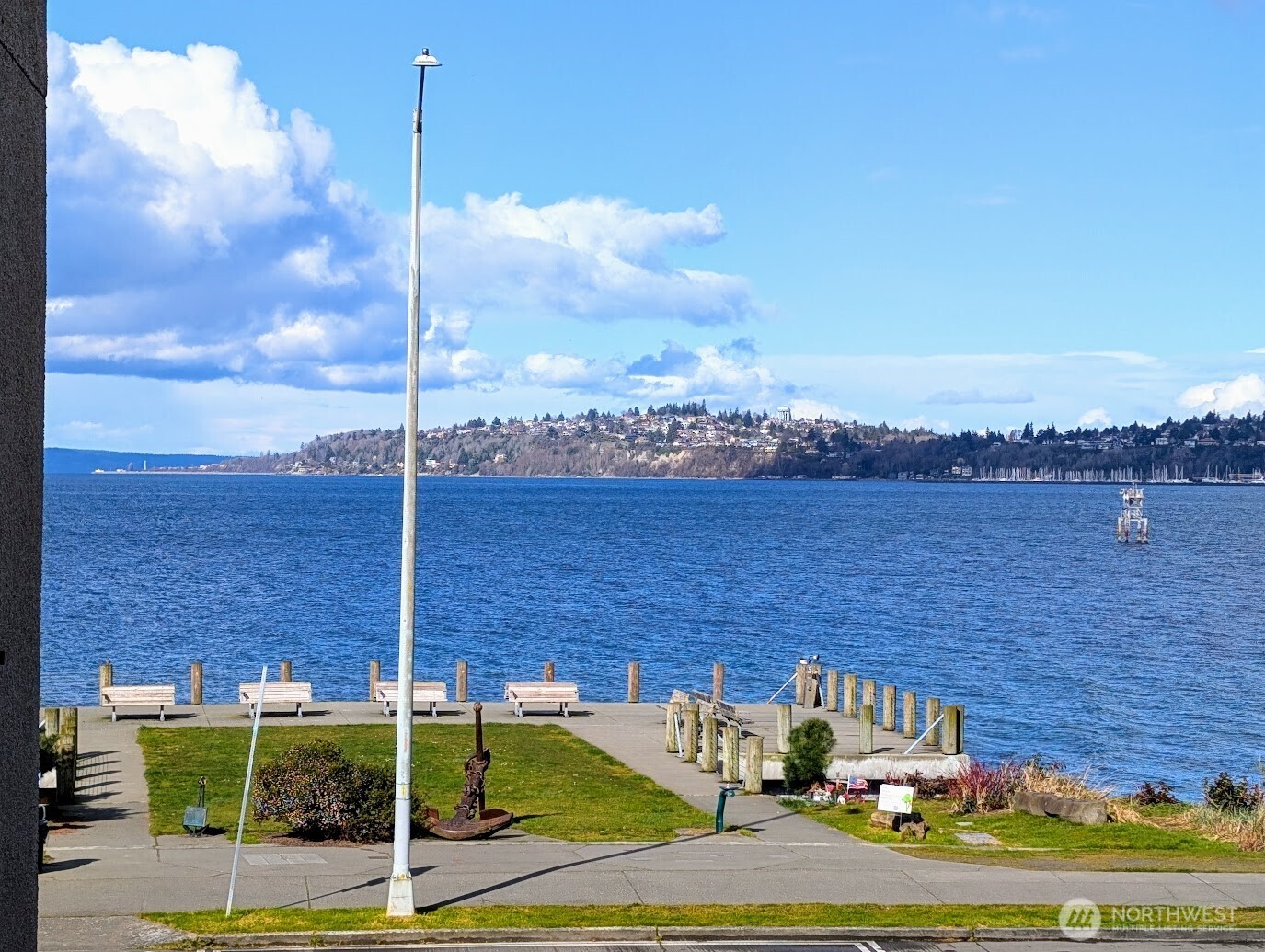 1156 Alki Avenue Southwest, Unit 201 Seattle, WA 98116 - Photo 1 of 40 a view of a terrace with lawn chairs
