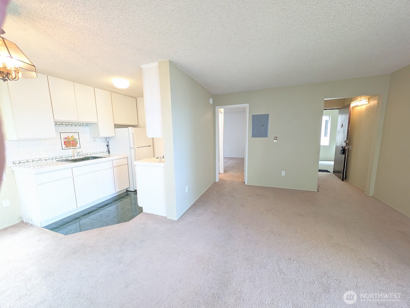 1156 Alki Avenue Southwest, Unit 201 Seattle, WA 98116 - Photo 15 of 40 a view of a kitchen with a sink