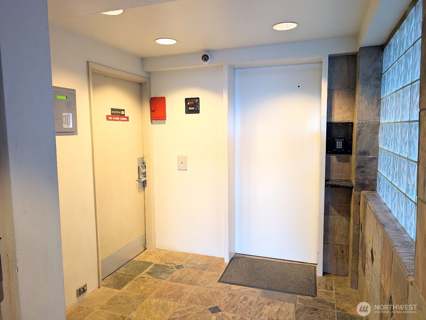 1156 Alki Avenue Southwest, Unit 201 Seattle, WA 98116 - Photo 21 of 40 a view of a hallway with wooden floor and staircase