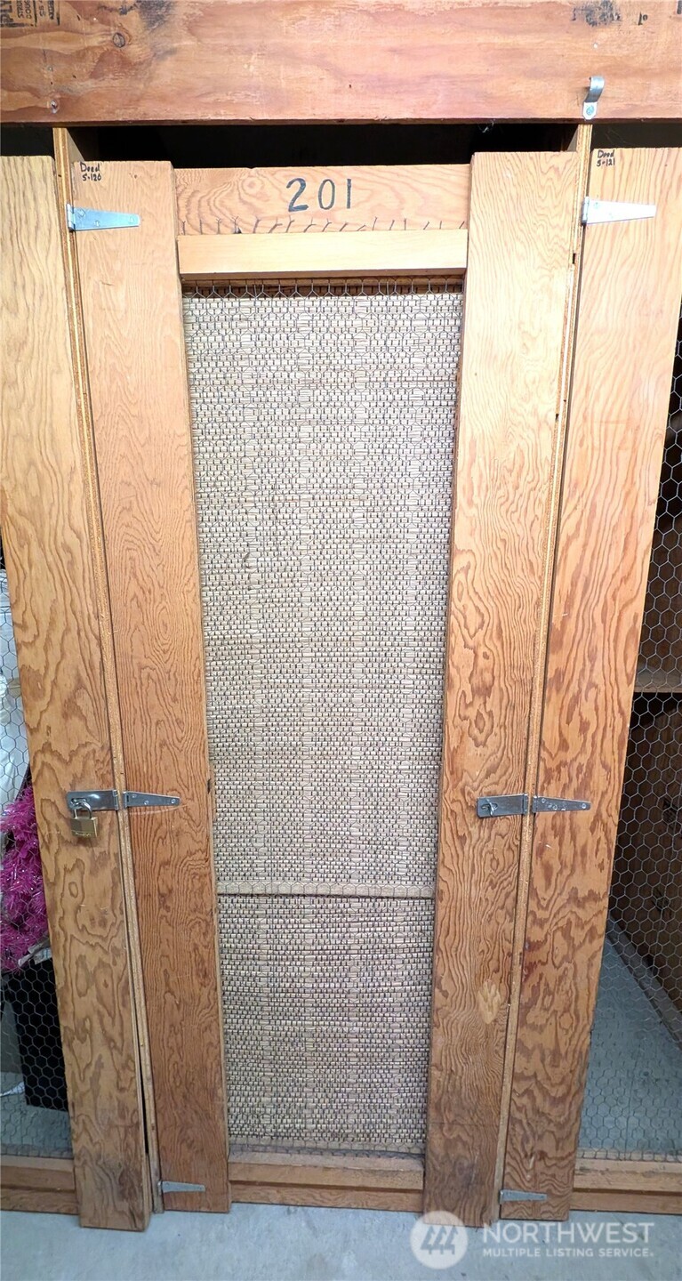 1156 Alki Avenue Southwest, Unit 201 Seattle, WA 98116 - Photo 22 of 40 a view of a door with wooden floor