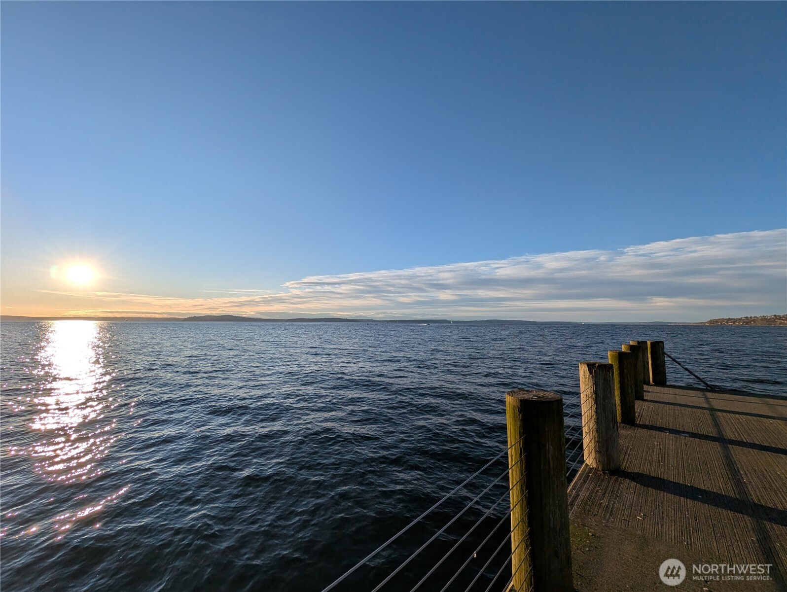 1156 Alki Avenue Southwest, Unit 201 Seattle, WA 98116 - Photo 32 of 40 a view of an ocean from a balcony