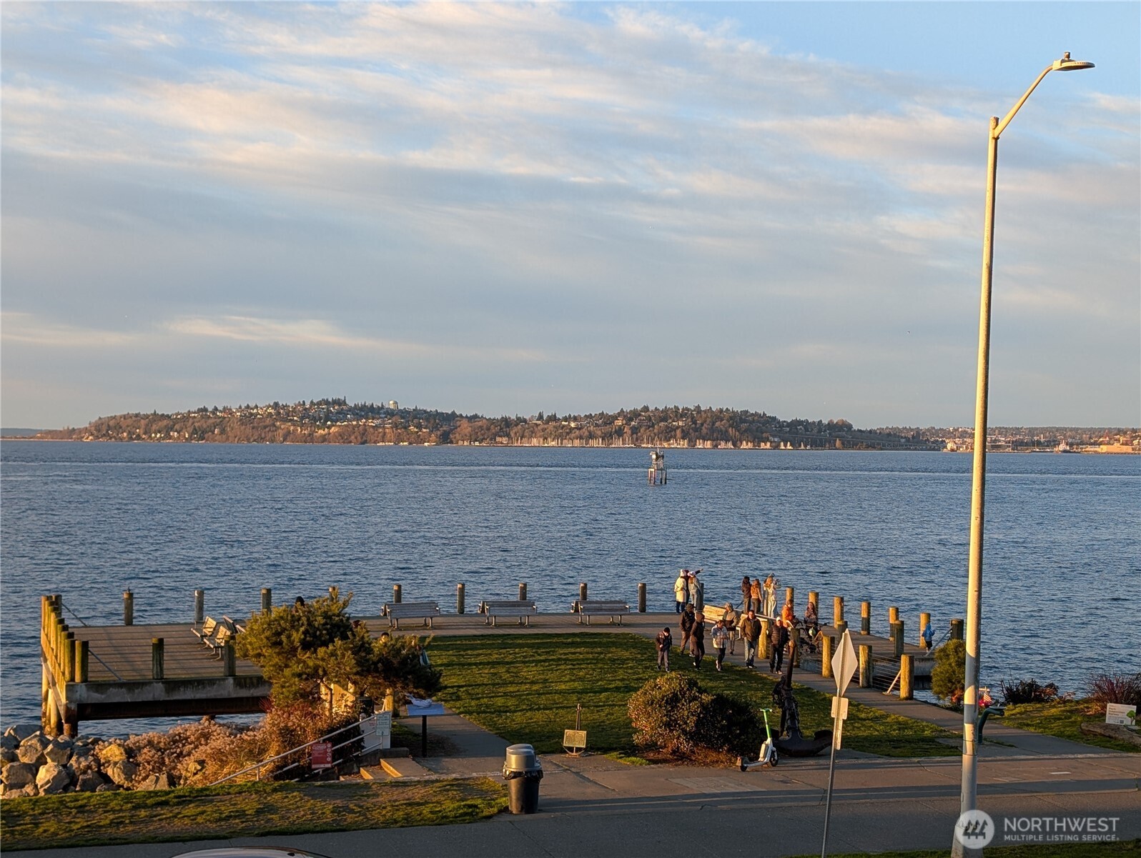 1156 Alki Avenue Southwest, Unit 201 Seattle, WA 98116 - Photo 40 of 40 a terrace with outdoor seating and city view