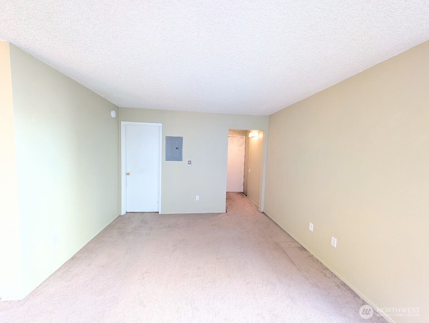 1156 Alki Avenue Southwest, Unit 201 Seattle, WA 98116 - Photo 5 of 40 a view of an empty room with a window