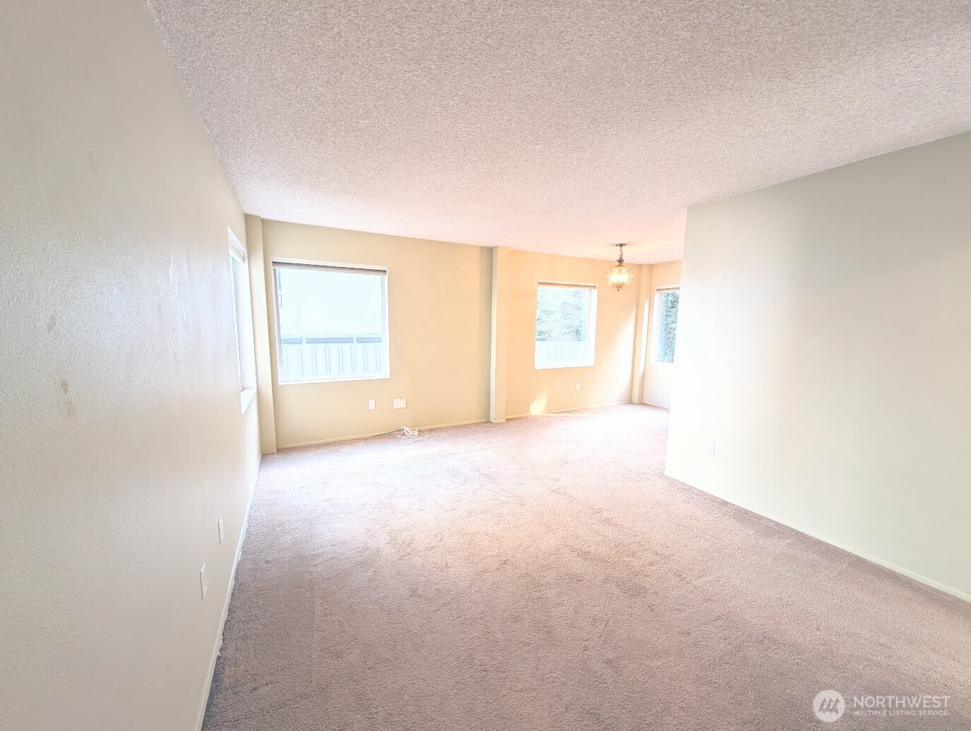 1156 Alki Avenue Southwest, Unit 201 Seattle, WA 98116 - Photo 7 of 40 an empty room with windows and closet