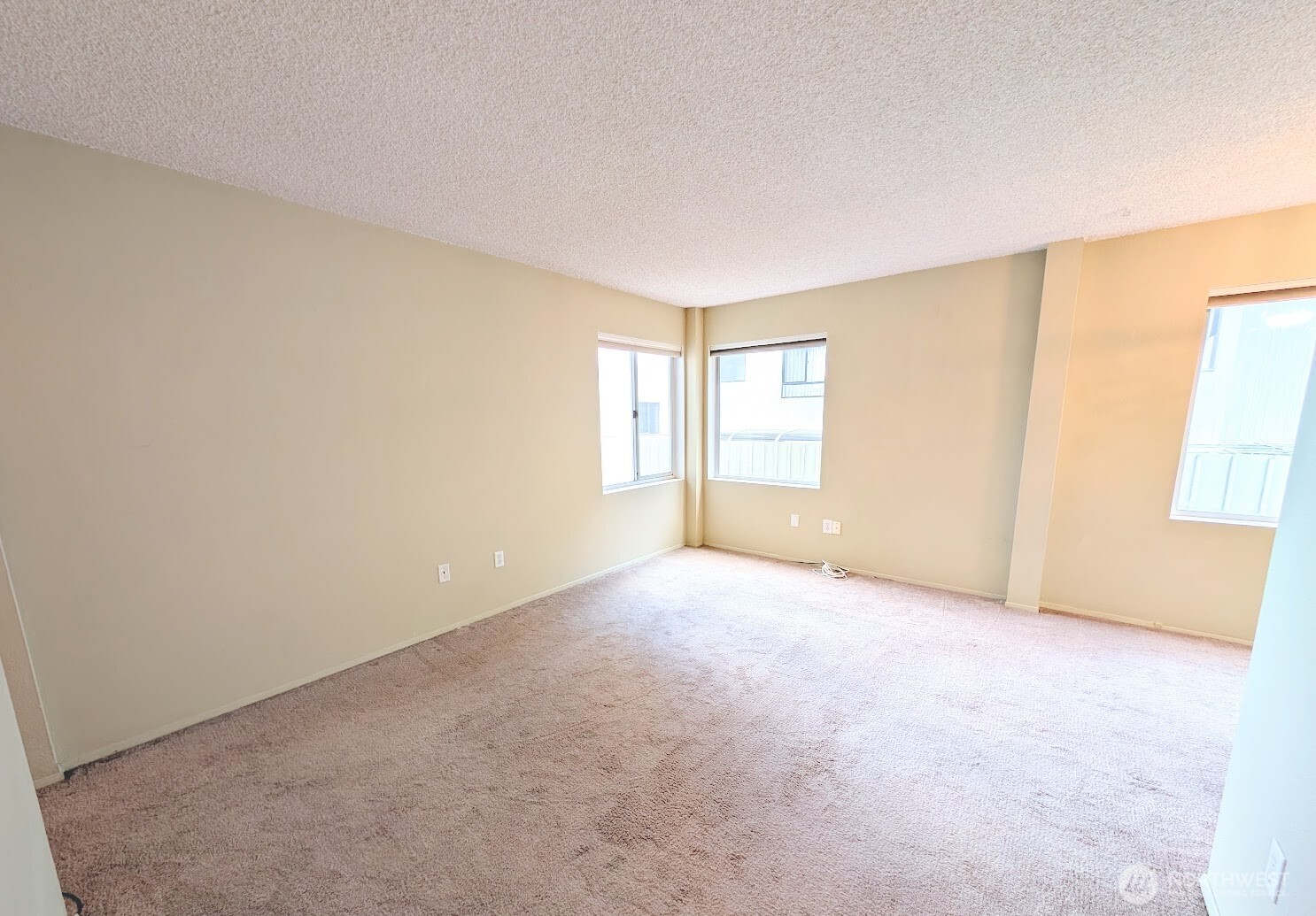 1156 Alki Avenue Southwest, Unit 201 Seattle, WA 98116 - Photo 8 of 40 an empty room with windows and closet