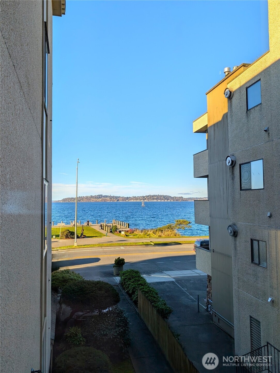 1156 Alki Avenue Southwest, Unit 201 Seattle, WA 98116 - Photo 9 of 40 a view of a room with floor to ceiling window and outdoor space