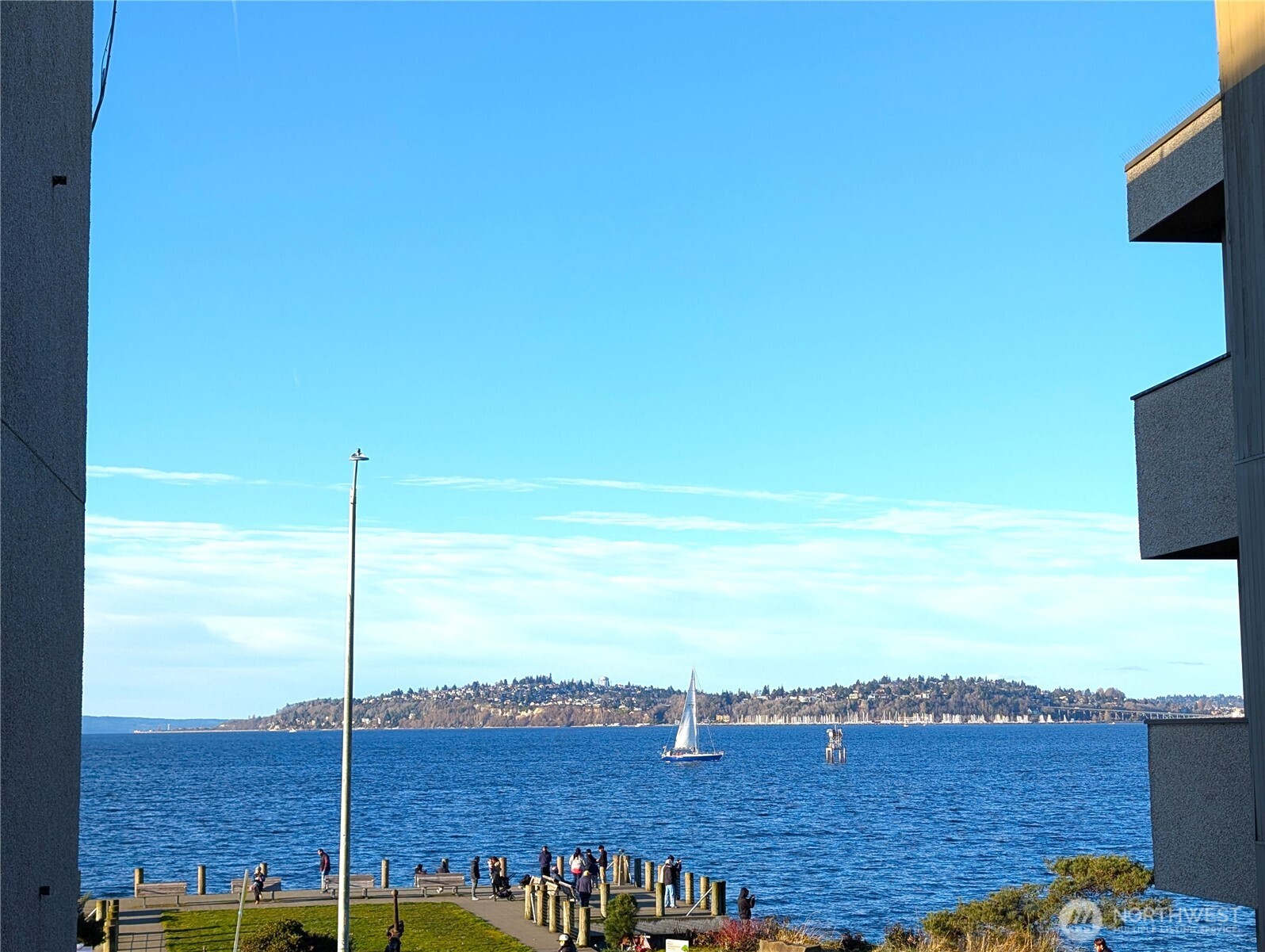 1156 Alki Avenue Southwest, Unit 201 Seattle, WA 98116 - Photo 10 of 40 a view of a city from a terrace
