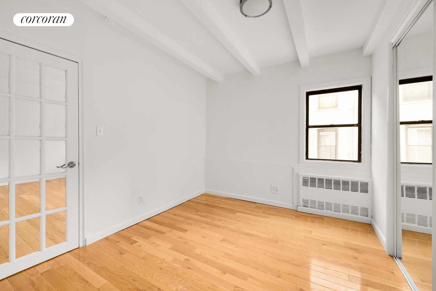 307 West 20th Street, Unit 4R Manhattan, NY 10011 - Photo 4 of 8 a view of an empty room with a window